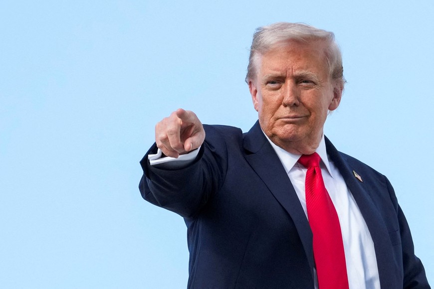 U.S. President Donald Trump gestures, while he boards Air Force One, as he departs for New York at Joint Base Andrews, Maryland, U.S., September 11, 2025. REUTERS/Ken Cedeno     TPX IMAGES OF THE DAY