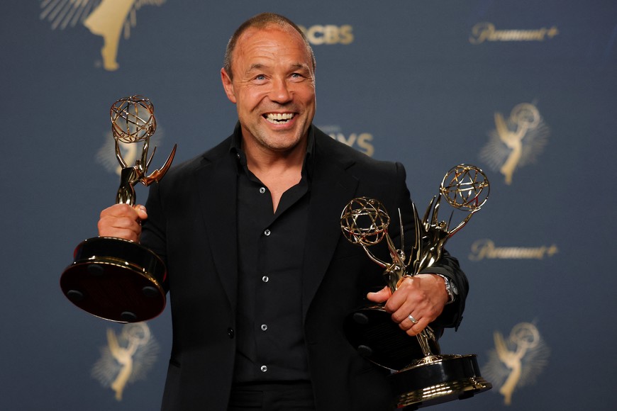 Stephen Graham, poses with the Best Lead Actor in a Limited or Anthology Series or Movie and Best Writing for a Limited or Anthology Series or Movie for "Adolescence" at the 77th Primetime Emmy Awards in Los Angeles, California, U.S., September 14, 2025. REUTERS/Daniel Cole
