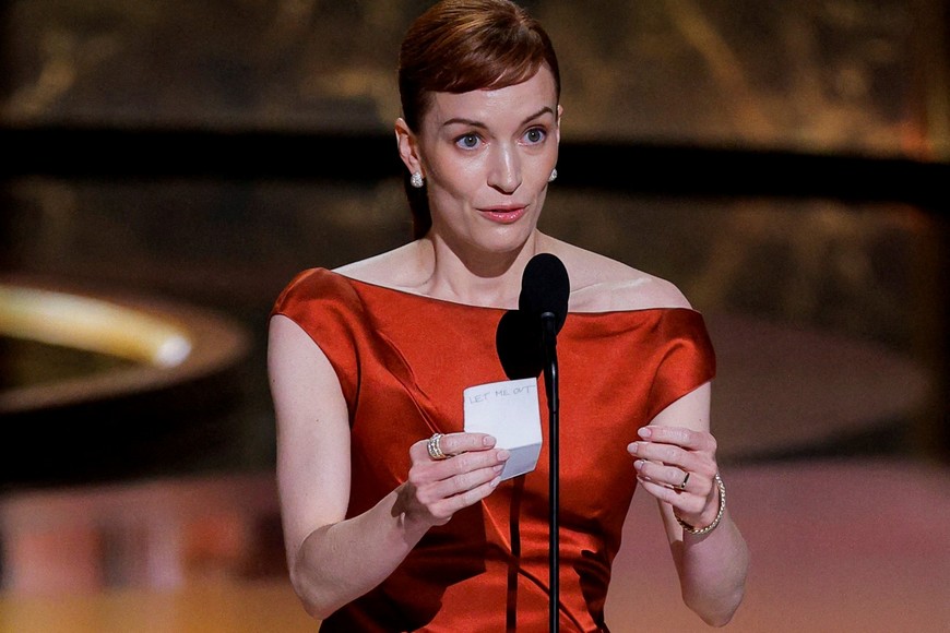 Britt Lower holds an acceptance speech note that has "LET ME OUT" written on it as she accepts the award for Lead Actress in a Drama Series for "Severance" at the 77th Primetime Emmy Awards in Los Angeles, California, U.S., September 14, 2025. REUTERS/Mike Blake