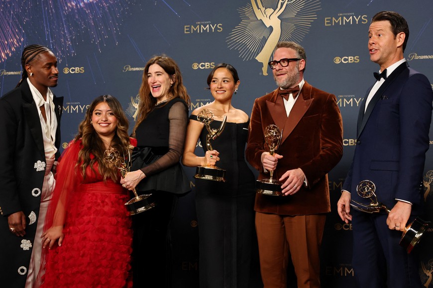 Seth Rogen, winner of Best Actor in a Comedy Series, Best Writing for a Comedy Series, and Best Directing for a Comedy Series, poses with cast members Kathryn Hahn, Chase Sui Wonders, Ike Barinholtz, Dewayne Perkins, Keyla Monterroso Mejia and team of "The Studio", which won Best Comedy Series at the 77th Primetime Emmy Awards in Los Angeles, California, U.S., September 14, 2025. REUTERS/Daniel Cole