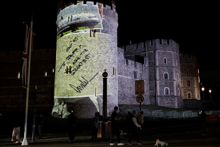 An inscription reading "To Jeff, you are the greatest!", a message found by The New York Times in a copy of U.S. President Donald Trump's book "Trump: The Art of the Comeback", which belonged to disgraced financier Jeffrey Epstein, is projected on Windsor castle, after U.S. President Donald Trump and first lady Melania Trump arrival for a state visit to the country, in Windsor, Berkshire, Britain September 16, 2025. REUTERS/Phil Noble