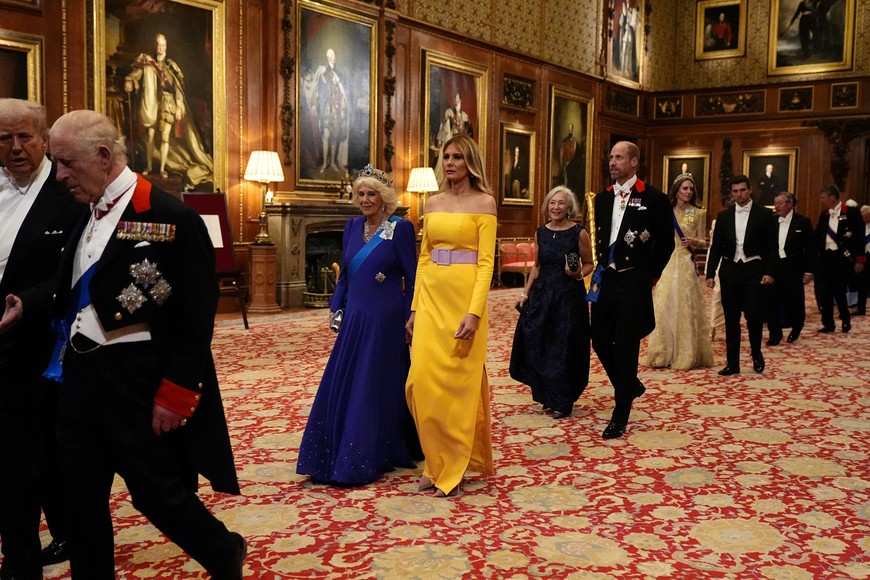 King Charles III and US President Donald Trump followed by Queen Camilla and First Lady Melania Trump, the Prince of Wales and Ms Paula Reynolds and the Princess of Wales with Michael Boulos, walk at the state banquet at Windsor Castle, Berkshire, on day one of US President Donald Trump and First Lady Melania Trump's second state visit to the UK, Wednesday September 17, 2025.    Aaron Chown/Pool via REUTERS