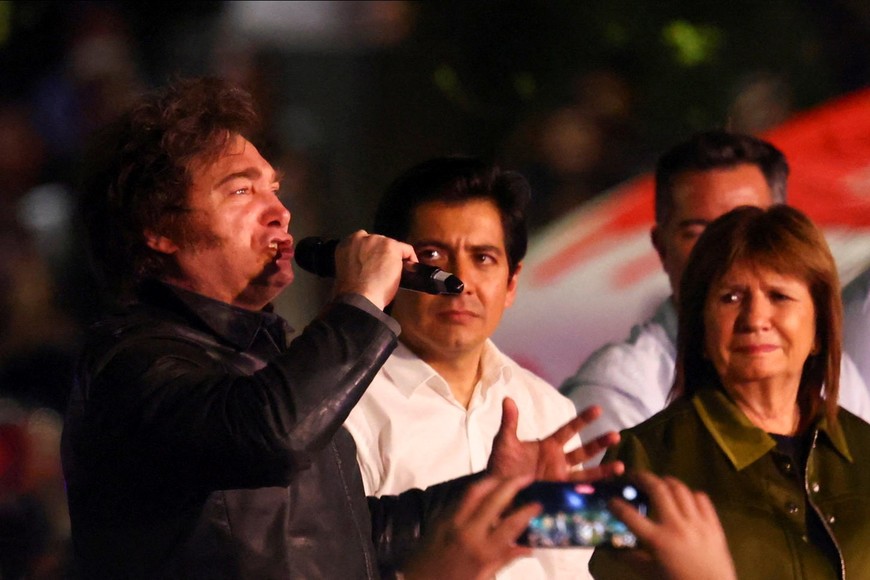 Argentina's President Javier Milei speaks next to Security Minister Patricia Bullrich during La Libertad Avanza party rally ahead of pivotal October midterm elections that could strip the libertarian leader of crucial congressional support for his reform agenda, in Cordoba, Argentina, September 19, 2025. REUTERS/Leandro Gomez