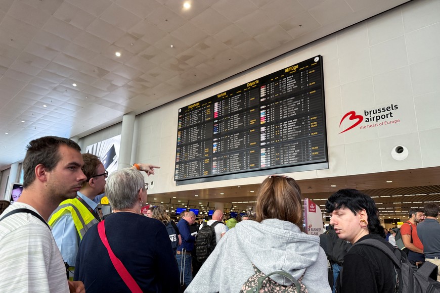 Travellers wait at Brussels airport, after a cyberattack at a service provider for check-in and boarding systems disrupted operations at several major European airports, in Zaventem near Brussels, Belgium September 20, 2025. REUTERS/Marta Fiorin