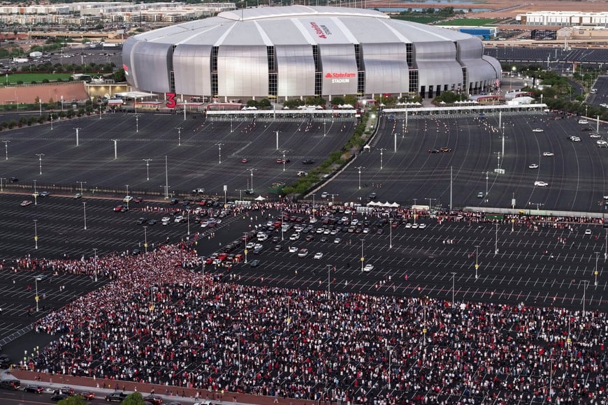 Drone view shows people arriving to attend a memorial service for slain conservative commentator Charlie Kirk at State Farm Stadium, in Glendale, Arizona, U.S., September 21, 2025.  REUTERS/Cheney Orr