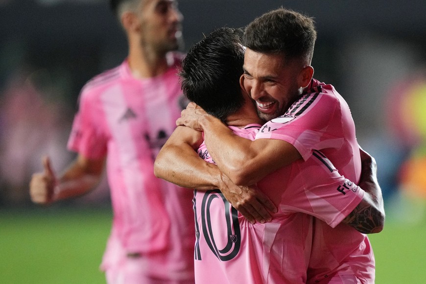 Sep 20, 2025; Fort Lauderdale, Florida, USA;  Inter Miami defender Jordi Alba (18) celebrates a goal by forward Lionel Messi (10) against D.C. United in the second half at Chase Stadium. Mandatory Credit: Jim Rassol-Imagn Images