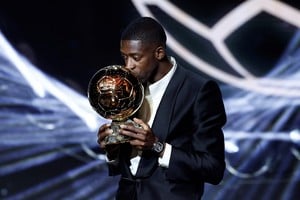 Soccer Football - Ballon d'Or - Theatre du Chatelet, Paris, France - September 22, 2025
Paris St Germain's Ousmane Dembele celebrates after winning the men's Ballon d'Or award REUTERS/Benoit Tessier