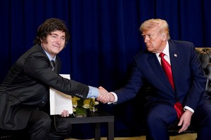 U.S. President Donald Trump shakes hands with Argentina's President Javier Milei as they meet during the 80th United Nations General Assembly, in New York City, New York, U.S., September 23, 2025. REUTERS/Al Drago