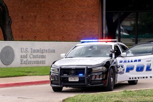 Law enforcement personnel respond at the scene of a shooting at an Immigration and Customs Enforcement (ICE) field office in Dallas, Texas, U.S., September 24, 2025.    REUTERS/Jeffrey McWhorter