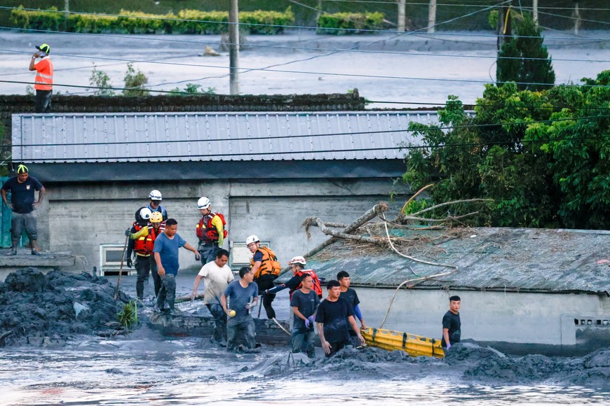 Rescue teams work in mud-covered areas after flooding brought by Super Typhoon Ragasa in Hualien, Taiwan, September 25, 2025. REUTERS/Ann Wang     TPX IMAGES OF THE DAY