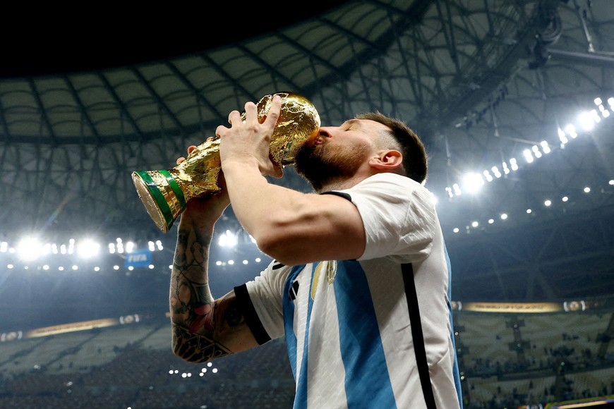 REUTERS PICTURES 40th ANNIVERSARY COLLECTION:  Soccer Football - FIFA World Cup Qatar 2022 - Final - Argentina v France - Lusail Stadium, Lusail, Qatar - December 18, 2022 
 Argentina's Lionel Messi kisses the trophy as he celebrates winning the World Cup REUTERS/Hannah Mckay      SEARCH "REUTERS PICTURES 40th ANNIVERSARY COLLECTION" FOR THIS PACKAGE
