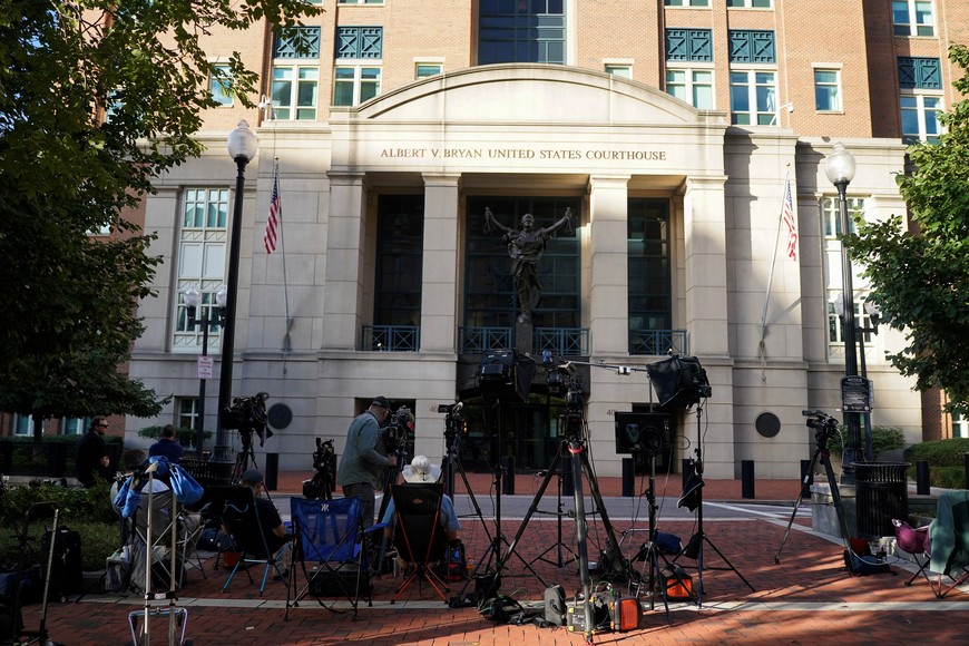 Members of the press work outside the Albert V. Bryan United States Courthouse, following the indictment of former FBI Director James Comey, in Alexandria, Virginia, U.S., September 26, 2025. REUTERS/Nathan Howard
