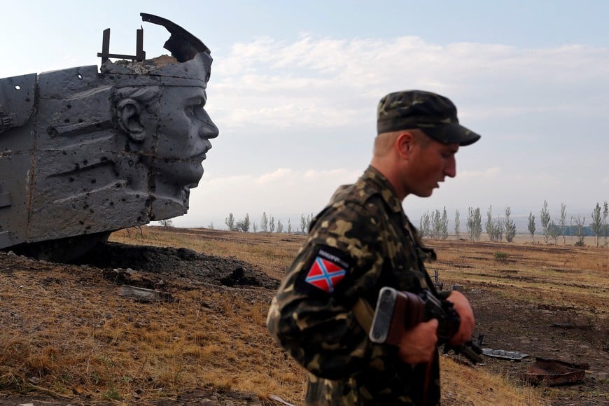 REUTERS PICTURES 40th ANNIVERSARY COLLECTION:  A Pro-Russian separatist stands near the damaged war memorial at Savur-Mohyla, a hill east of the city of Donetsk, August 28, 2014. Ukrainian President Petro Poroshenko said on Thursday that Russian forces had entered his country and the military conflict was worsening after Russian-backed separatists swept into a key town in the east. REUTERS/Maxim Shemetov SEARCH "REUTERS PICTURES 40th ANNIVERSARY COLLECTION" FOR THIS PACKAGE