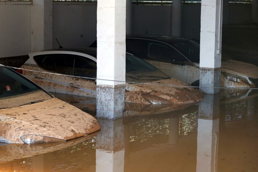 Cars sit submerged in flooded residential garages after storm Gabrielle hit the island, in Ibiza, Spain October 1, 2025. REUTERS/Francisco Ubilla