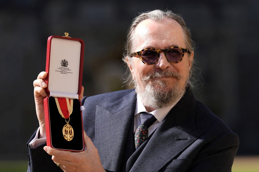Actor Gary Oldman poses after being made a Knight Bachelor at an investiture ceremony at Windsor Castle, in Windsor, Britain September 30, 2025. Andrew Matthews/Pool via REUTERS