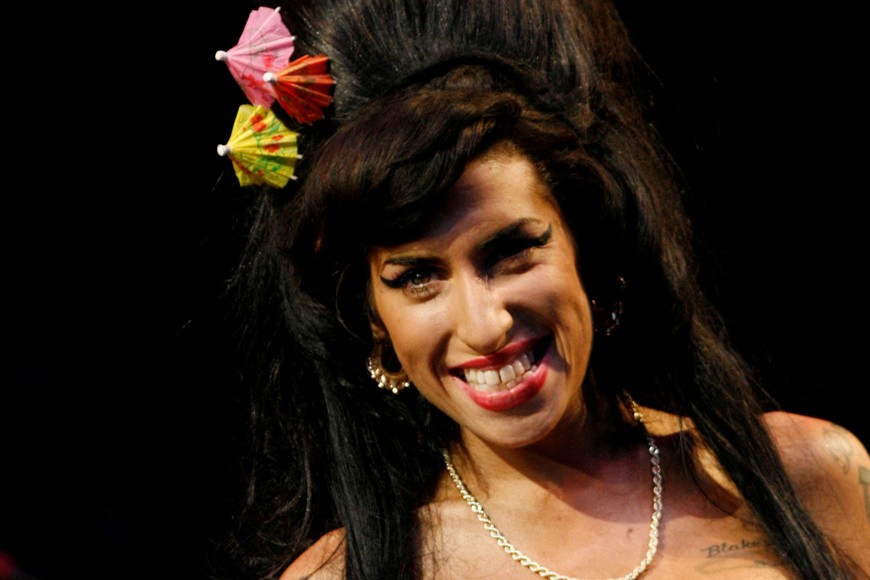 FILE PHOTO: British singer Amy Winehouse performs at the Glastonbury Festival 2008 in Somerset in south west England June 28, 2008. REUTERS/Luke MacGregor/File Photo