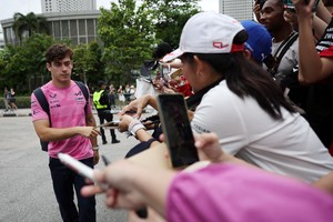 Formula One F1 - Singapore Grand Prix - Marina Bay Street Circuit, Singapore - October 3, 2025
Alpine's Franco Colapinto interacts with fans ahead of practice REUTERS/Athit Perawongmetha