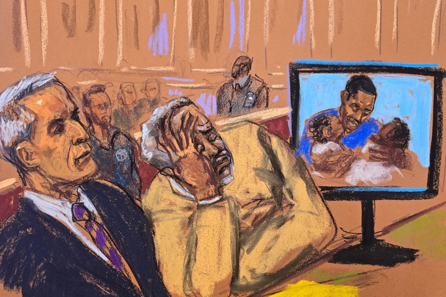 Sean "Diddy" Combs becomes emotional as his children as babies are shown on a screen during a court sentencing, after the music mogul was convicted on charges of transporting prostitutes to engage in drug-fueled sexual performances, in New York City, U.S., October 3, 2025 in this courtroom sketch. REUTERS/Jane Rosenberg TPX IMAGES OF THE DAY