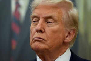 FILE PHOTO: U.S. President Donald Trump looks on, on the day he announces a deal with Pfizer to sell drugs at lower prices, in the Oval office of the White House in Washington, D.C., U.S., September 30, 2025. REUTERS/Ken Cedeno/File Photo