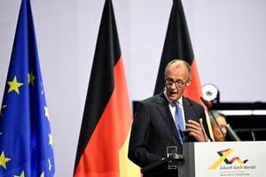 German Chancellor Friedrich Merz speaks during reunification celebrations on the Day of German Unity 35th anniversary at the Congresshalle hall in Saarbruecken, Germany, October 3, 2025. Jean-Christophe Verhaegen/Pool via REUTERS