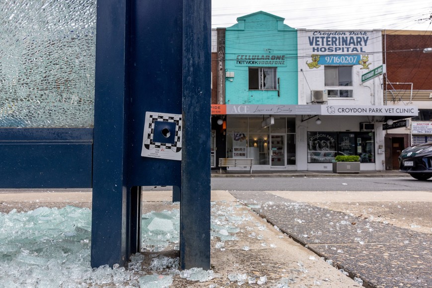 An evidence marker is placed on a waiting station at the site of a shooting incident, where multiple people were wounded on Sunday, in Croydon Park in Sydney, Australia, October 6, 2025.  AAP/Sitthixay Ditthavong via REUTERS    ATTENTION EDITORS - THIS IMAGE WAS PROVIDED BY A THIRD PARTY. NO RESALES. NO ARCHIVE. AUSTRALIA OUT. NEW ZEALAND OUT. NO COMMERCIAL OR EDITORIAL SALES IN NEW ZEALAND. NO COMMERCIAL OR EDITORIAL SALES IN AUSTRALIA.