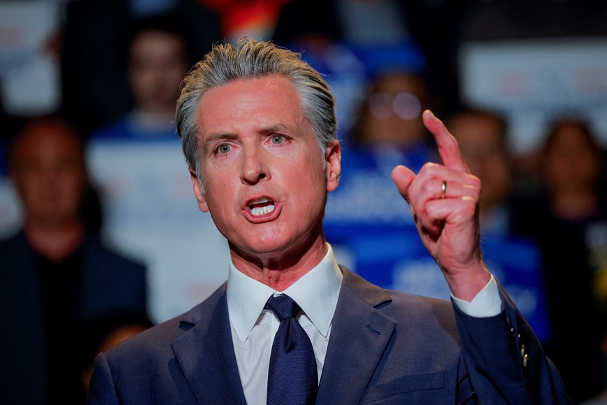 California Governor Gavin Newsom, along with local congressional representatives, state officials and supporters, speaks as he announces the redrawing of California's congressional maps, calling on voters to approve a ballot measure, in response to a similar move in Texas being supported by U.S. President Donald Trump, in Los Angeles, California, U.S., August 14, 2025.  REUTERS/Mike Blake