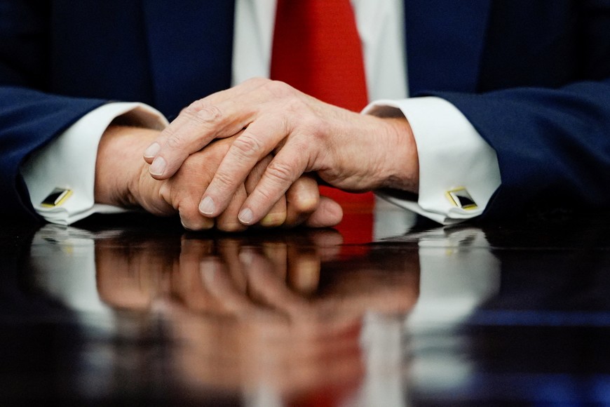 Detail on the hands of U.S. President Donald Trump during an event to sign an executive order authorizing the construction of an access road to the Ambler mining district in Alaska, at the White House, in Washington, D.C., U.S., October 6, 2025. REUTERS/Kent Nishimura