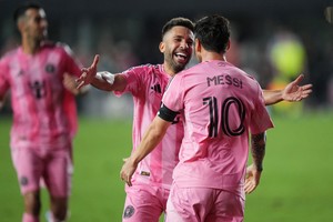 Sep 20, 2025; Fort Lauderdale, Florida, USA;  Inter Miami defender Jordi Alba (18) celebrates a goal by forward Lionel Messi (10) against D.C. United in the second half at Chase Stadium. Mandatory Credit: Jim Rassol-Imagn Images