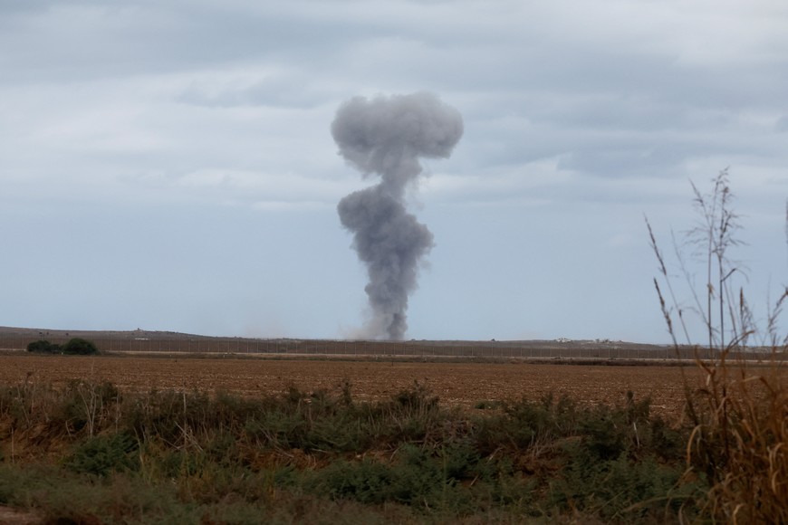 Smoke rises from Gaza, after U.S. President Donald Trump announced that Israel and Hamas agreed on the first phase of a Gaza ceasefire, as seen from the Israeli side of the border with Gaza, October 9, 2025. REUTERS/Ammar Awad