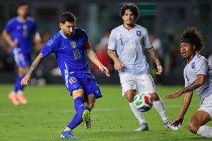 Oct 14, 2025; Fort Lauderdale, Florida, USA; Argentina forward Lionel Messi (10) shoots the ball against Puerto Rico midfielder Isaac Angking (8) during the first half at Chase Stadium. Mandatory Credit: Sam Navarro-Imagn Images