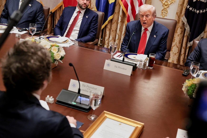 U.S. President Donald Trump attends lunch with Argentina's President Javier Milei in the Cabinet Room at the White House in Washington, D.C., U.S., October 14, 2025. REUTERS/Jonathan Ernst
