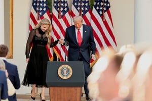U.S. President Donald Trump walks with Erika Kirk, wife of slain conservative commentator Charlie Kirk and the new CEO of Turning Point USA, during to posthumously award the Medal of Freedom to Charlie Kirk in the Rose Garden at the White House in Washington, D.C., U.S., October 14, 2025. REUTERS/Jonathan Ernst