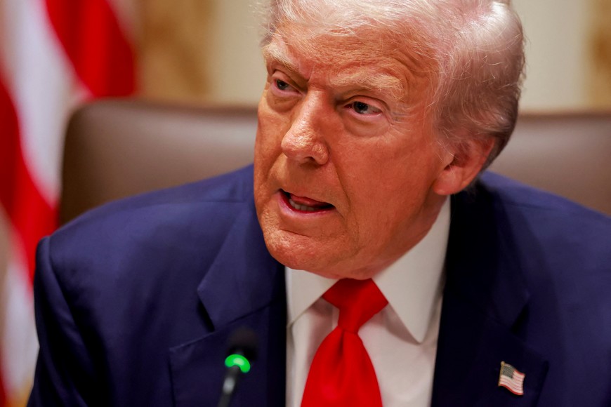 U.S. President Donald Trump listens to a reporter's question before his lunch with Argentina's President Javier Milei in the Cabinet Room at the White House in Washington, D.C., U.S., October 14, 2025. REUTERS/Jonathan Ernst