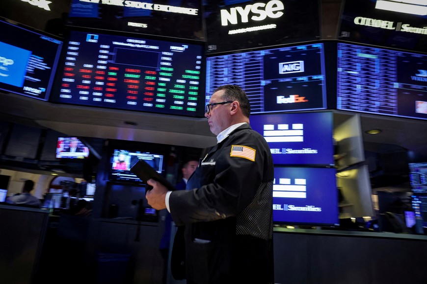 FILE PHOTO: A trader works on the floor at the New York Stock Exchange (NYSE) in New York City, U.S., April 2, 2025.  REUTERS/Brendan McDermid/File Photo
