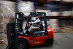 An employee drives a forklift at Lumilagro’s factory, which now operates only one of its four assembly lines due to cheaper imported components and reduced demand, as Argentines face reduced consumer purchasing power under President Javier Milei’s austerity measures, in Tortuguitas, on the outskirts of Buenos Aires, Argentina, October 3, 2025. REUTERS/Agustin Marcarian