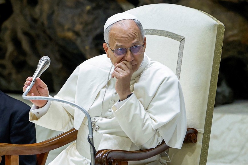 Pope Leo XIV listens to a question from the faithful during an audience for the Jubilee of the Roma, Sinti and Travelling Peoples in Paul VI Hall at the Vatican, October 18, 2025. REUTERS/Remo Casilli