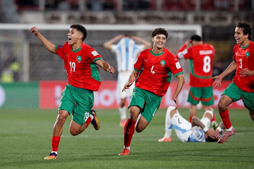 Soccer Football - FIFA U-20 World Cup - Final - Argentina v Morocco - Estadio Nacional Julio Martinez Pradanos, Santiago, Chile - October 19, 2025
Morocco's Ismail Bakhty and Ismael Baouf celebrate as Argentina's Maher Carrizo looks dejected after the match REUTERS/Rodrigo Garrido