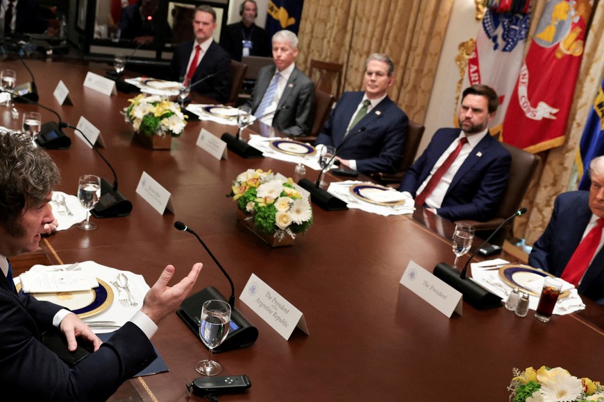 Argentina's President Javier Milei addresses U.S. President Donald Trump before their lunch in the Cabinet Room at the White House in Washington, D.C., U.S., October 14, 2025. REUTERS/Jonathan Ernst