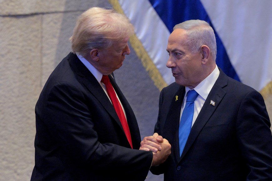 JERUSALEM - OCTOBER 13: U.S. President Donald Trump Israeli and Prime Minister Benjamin Netanyahu interact after Netanyahu addressed the Knesset on October 13, 2025 in Jerusalem.  Chip Somodevilla/Pool via REUTERS