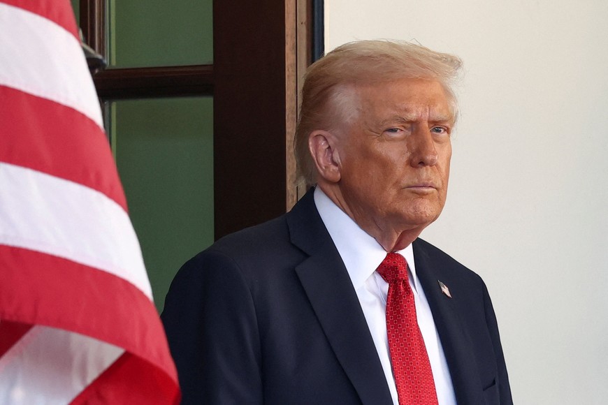 U.S. President Donald Trump waits for Australia's Prime Minister Anthony Albanese's arrival at the White House in Washington, D.C., U.S. October 20, 2025. REUTERS/Kevin Lamarque