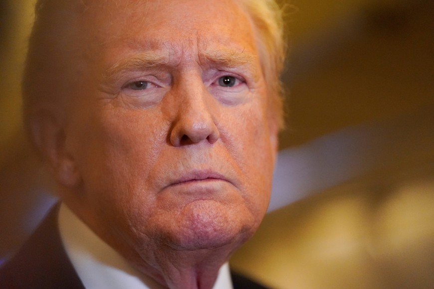 U.S. President Donald Trump looks on while speaking to members of the media as he flies from Florida to Joint Base Andrews en route to Washington, aboard Air Force One, U.S., October 19, 2025. REUTERS/Elizabeth Frantz