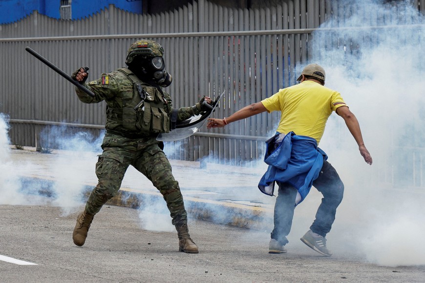 An army member clashes with a protester during a demonstration against diesel price hikes and other economic measures by Ecuadorean President Daniel Noboa’s government, marking 533 years of Indigenous resistance, in Quito, Ecuador October 12, 2025. REUTERS/Karen Toro     TPX IMAGES OF THE DAY