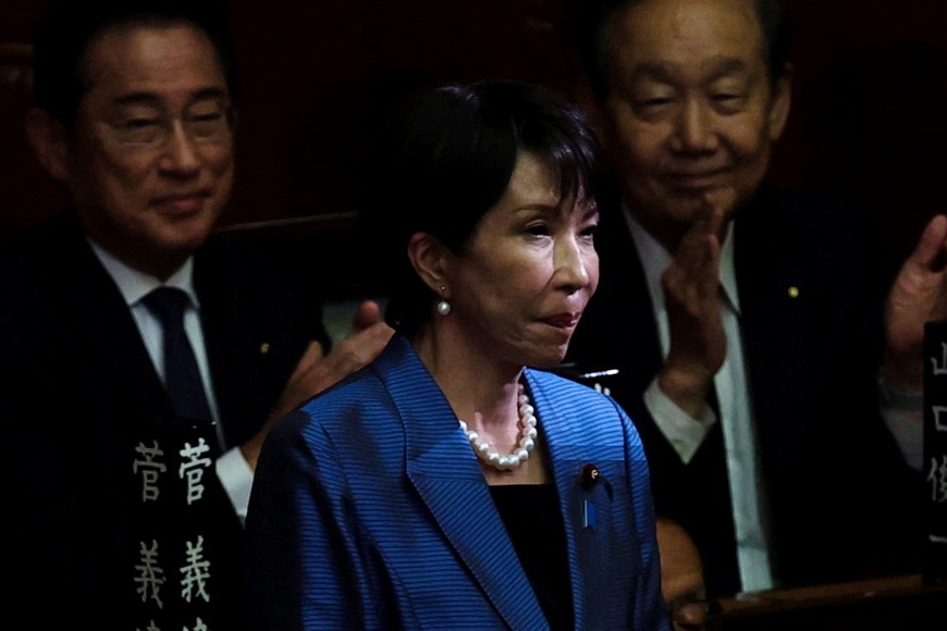 Leader of Japan's ruling Liberal Democratic Party (LDP) Sanae Takaichi reacts as she receives applause after being elected as prime minister, at the Lower House of Parliament in Tokyo, Japan October 21, 2025. REUTERS/Kim Kyung-Hoon     TPX IMAGES OF THE DAY