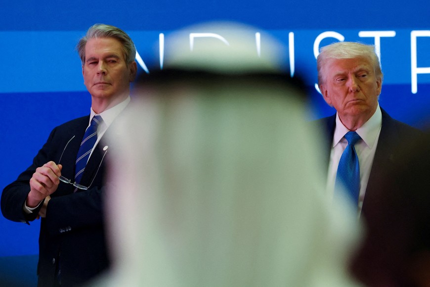 FILE PHOTO: U.S. Secretary of the Treasury Scott Bessent and U.S. President Donald Trump attend a business forum at Qasr Al Watan during the final stop of his Gulf visit, in Abu Dhabi, United Arab Emirates, May 16, 2025. REUTERS/Amr Alfiky/File Photo