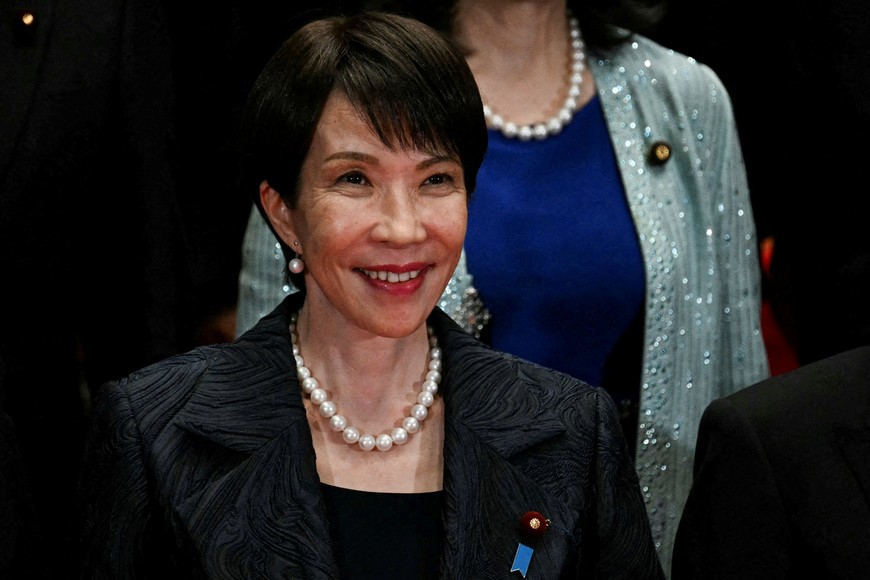 Japan's new Prime Minister Sanae Takaichi poses during a photo session with members of her cabinet at the prime minister's official residence in Tokyo on October 21, 2025.     PHILIP FONG/Pool via REUTERS