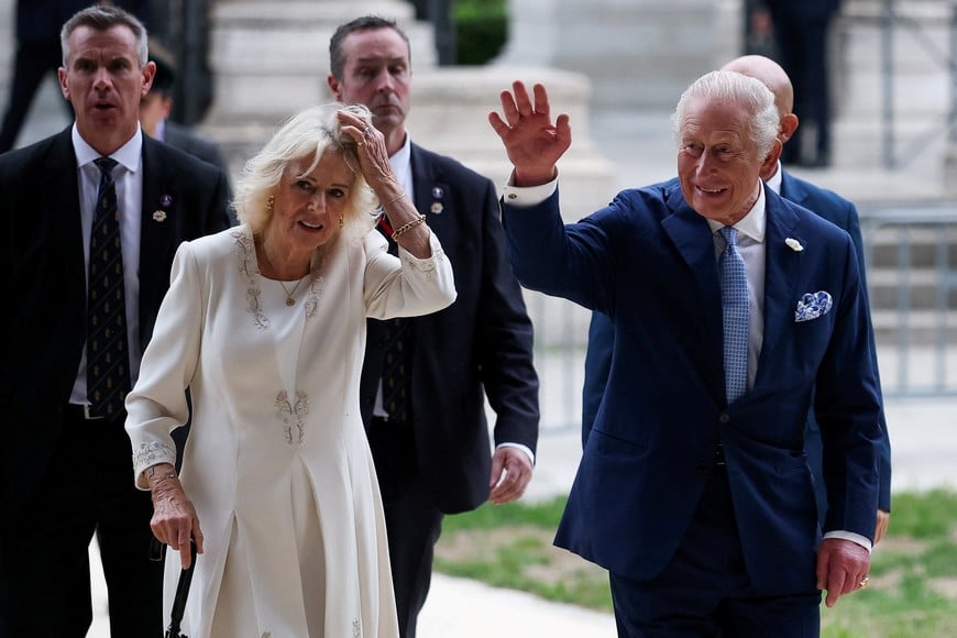 Britain's King Charles gestures next to Queen Camilla following a service at the Basilica of St Paul's Outside the Walls, where King Charles became a Royal Confrater of the Abbey, as part of their first state visit to the Holy See since Pope Leo XIV's election, in Rome, Italy, October 23, 2025. REUTERS/Phil Noble
