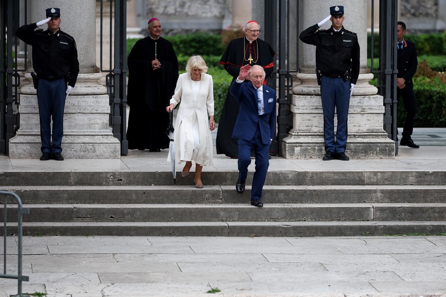 Britain's King Charles and Queen Camilla walk following a service at the Basilica of St Paul's Outside the Walls, where King Charles became a Royal Confrater of the Abbey, as part of their first state visit to the Holy See since Pope Leo XIV's election, in Rome, Italy, October 23, 2025. REUTERS/Phil Noble