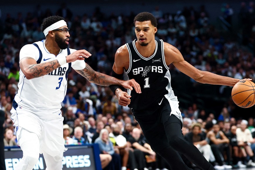 Oct 22, 2025; Dallas, Texas, USA;   San Antonio Spurs forward Victor Wembanyama (1) drives to the basket as Dallas Mavericks forward Anthony Davis (3) defends during the second half at American Airlines Center. Mandatory Credit: Kevin Jairaj-Imagn Images