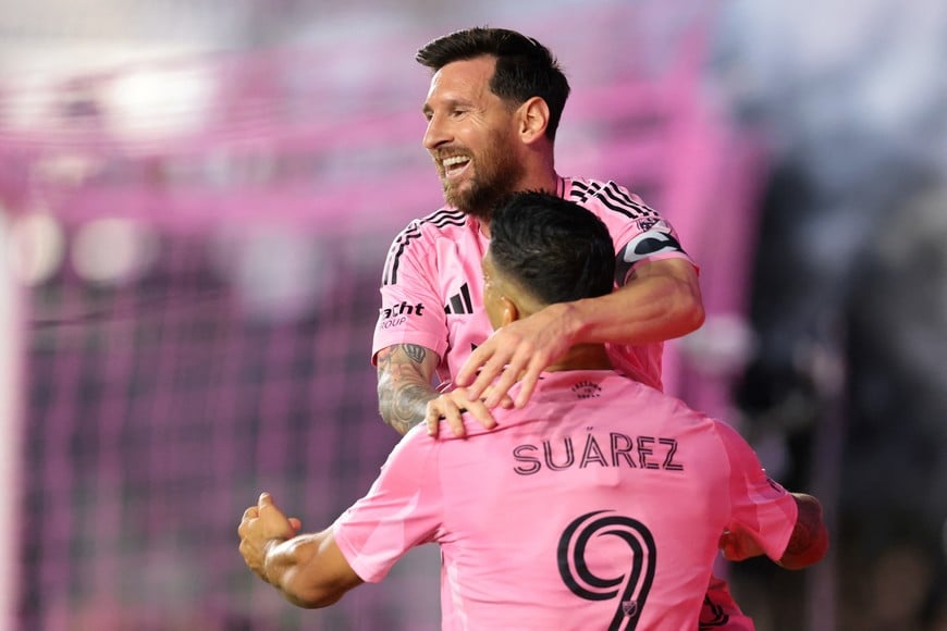Oct 24, 2025; Fort Lauderdale, Florida, USA; Inter Miami CF forward Lionel Messi (10) celebrates with forward Luis Suarez (9) after scoring against Nashville SC during the first half at Chase Stadium. Mandatory Credit: Sam Navarro-Imagn Images