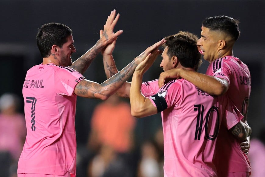 Aug 16, 2025; Fort Lauderdale, Florida, USA; Inter Miami CF forward Luis Suarez (9) celebrates with forward Lionel Messi (10), midfielder Baltasar Rodriguez (11) and midfielder Rodrigo De Paul (7) after scoring a goal against Los Angeles Galaxy during the second half at Chase Stadium. Mandatory Credit: Sam Navarro-Imagn Images